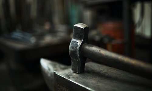Steel hammer on anvil